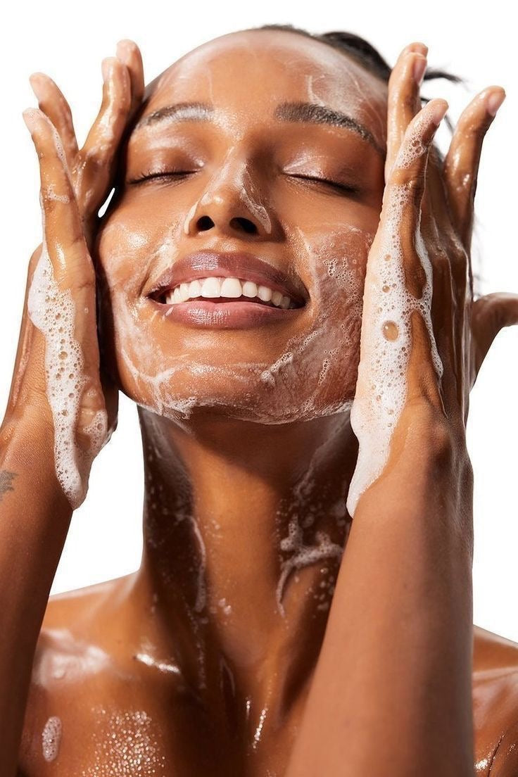 Woman washing/scrubbing her face with cleanser